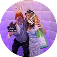 Guests posing with props in front of the LED Inflatable Photo Booth in Nottingham